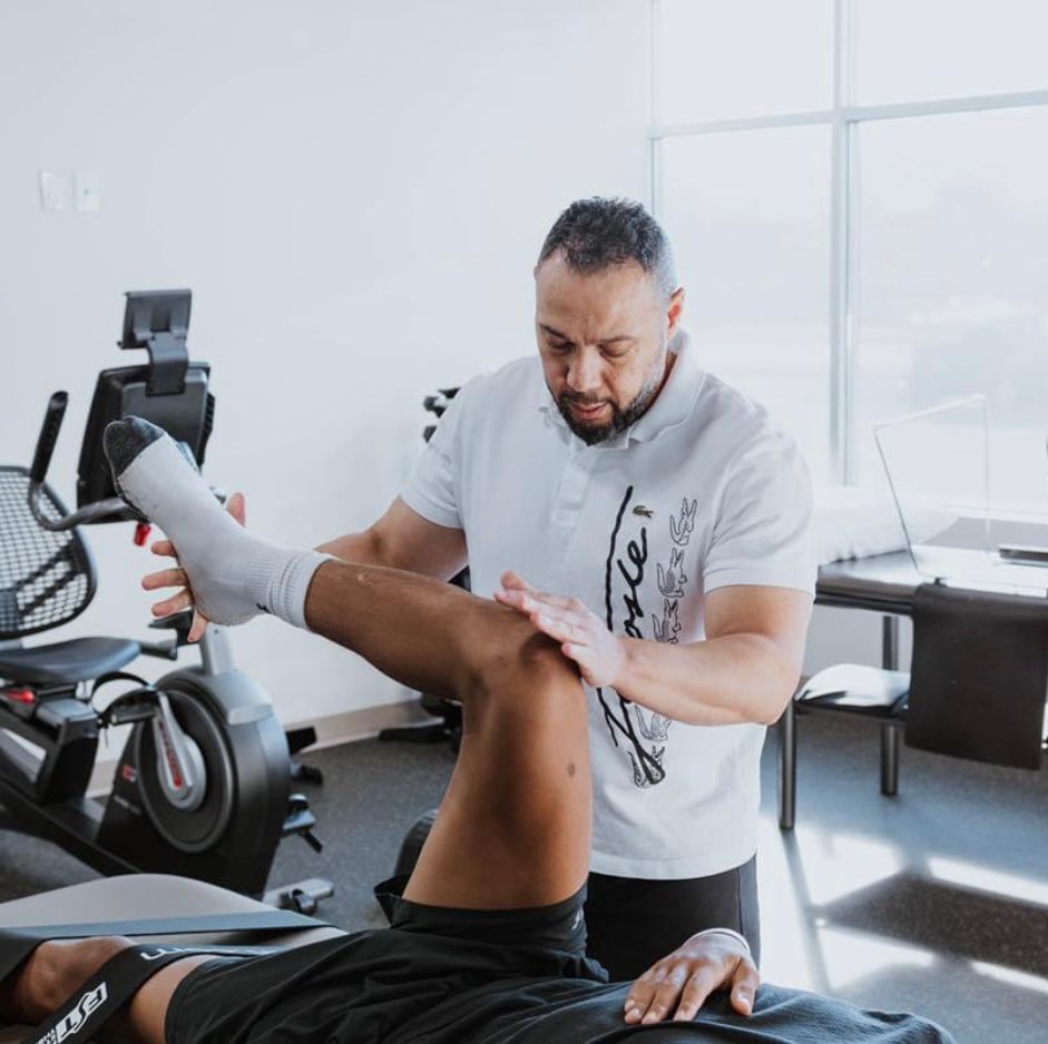 Ghassan treating a patient's leg in clinic
