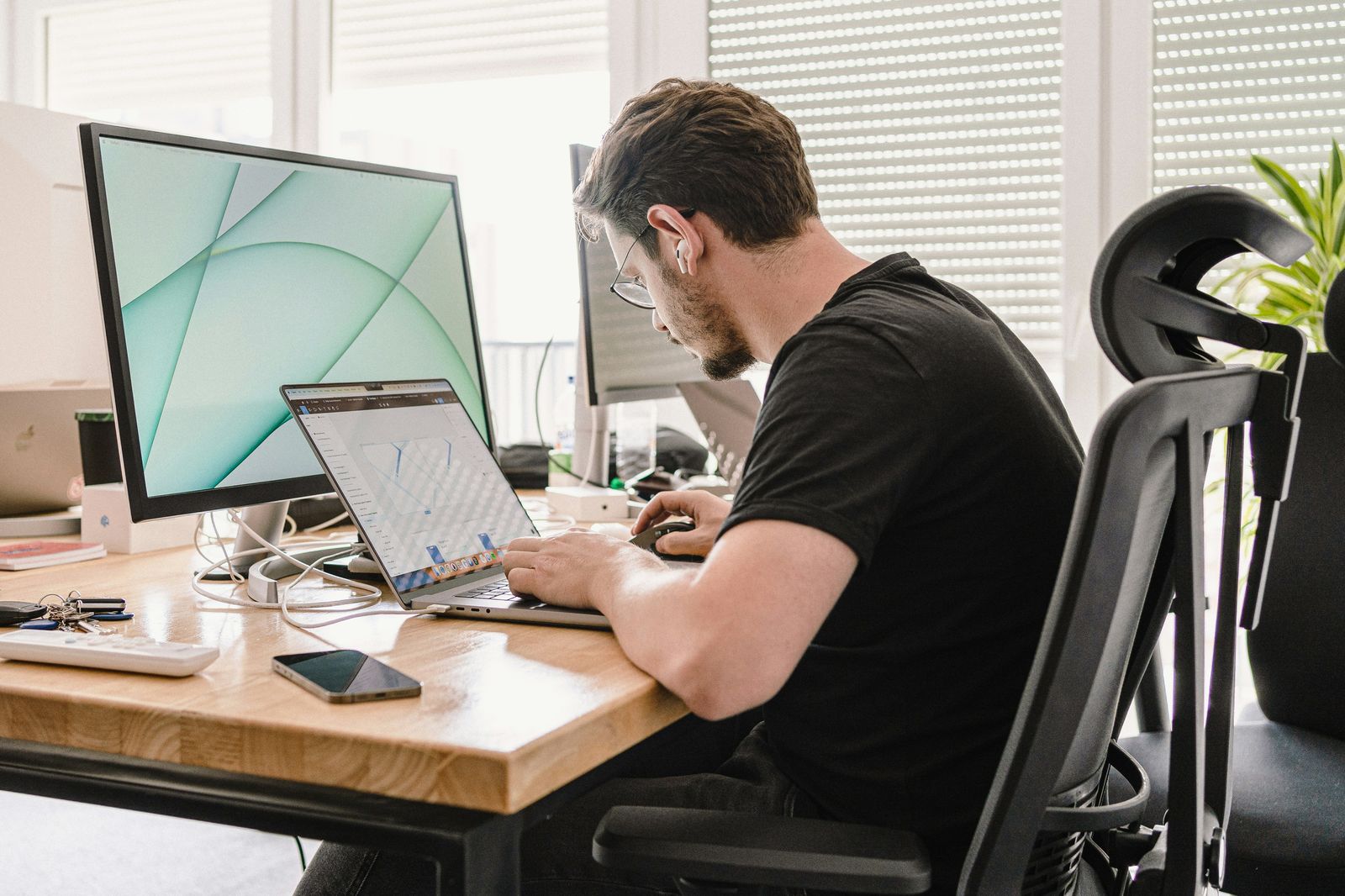 Someone working at a desk, a common source of posture strain